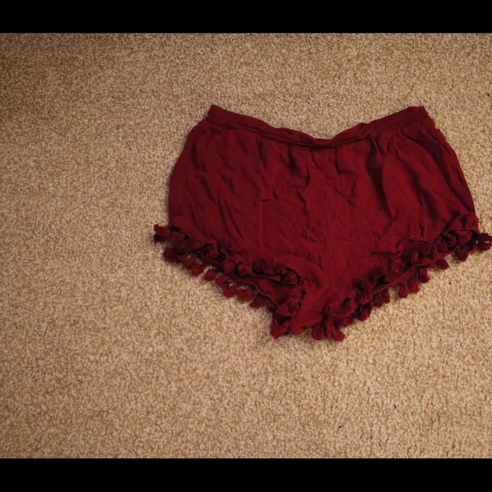 Short shorts with tassels
